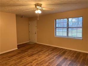 1235 Riverside Drive, Unit H1 Gainesville, GA 30501 - Photo 10 of 19 a view of empty room with wooden floor and fan