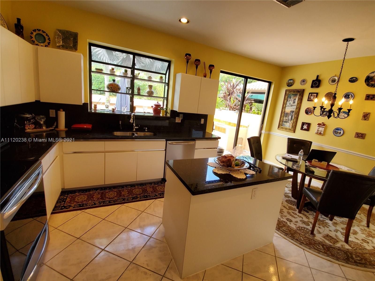 6468 Via Rosa Boca Raton, FL 33433 - Photo 22 of 60 a kitchen with a sink and a stove top oven