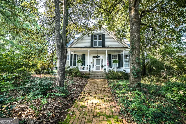 a front view of a house with yard