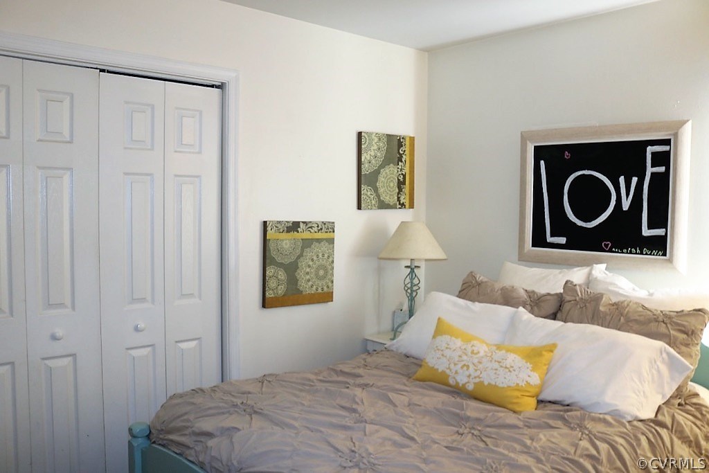 7211 Full Rack Drive Midlothian, VA 23112 - Photo 12 of 22 a bedroom with a bed and painting on the wall