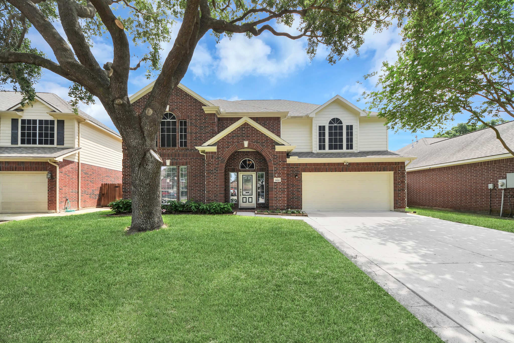 7622 McCormick Mill Court Houston, TX 77095 - Photo 1 of 37 a front view of a house with a yard and garage