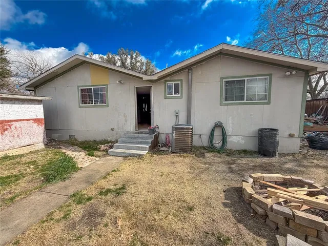 a side view of a house with patio