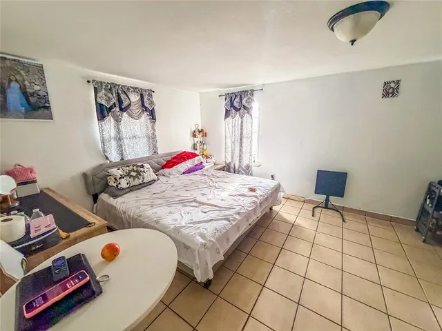 a bedroom with furniture and a bed