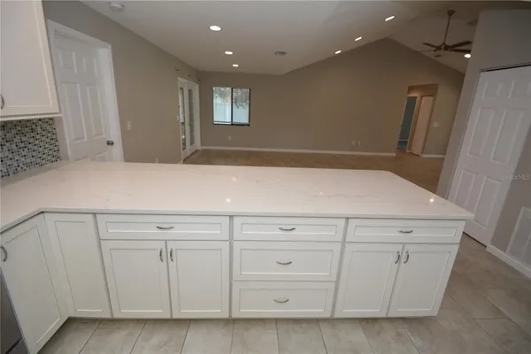 a view of a kitchen with cabinets