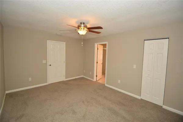 an empty room with a view of a bathroom