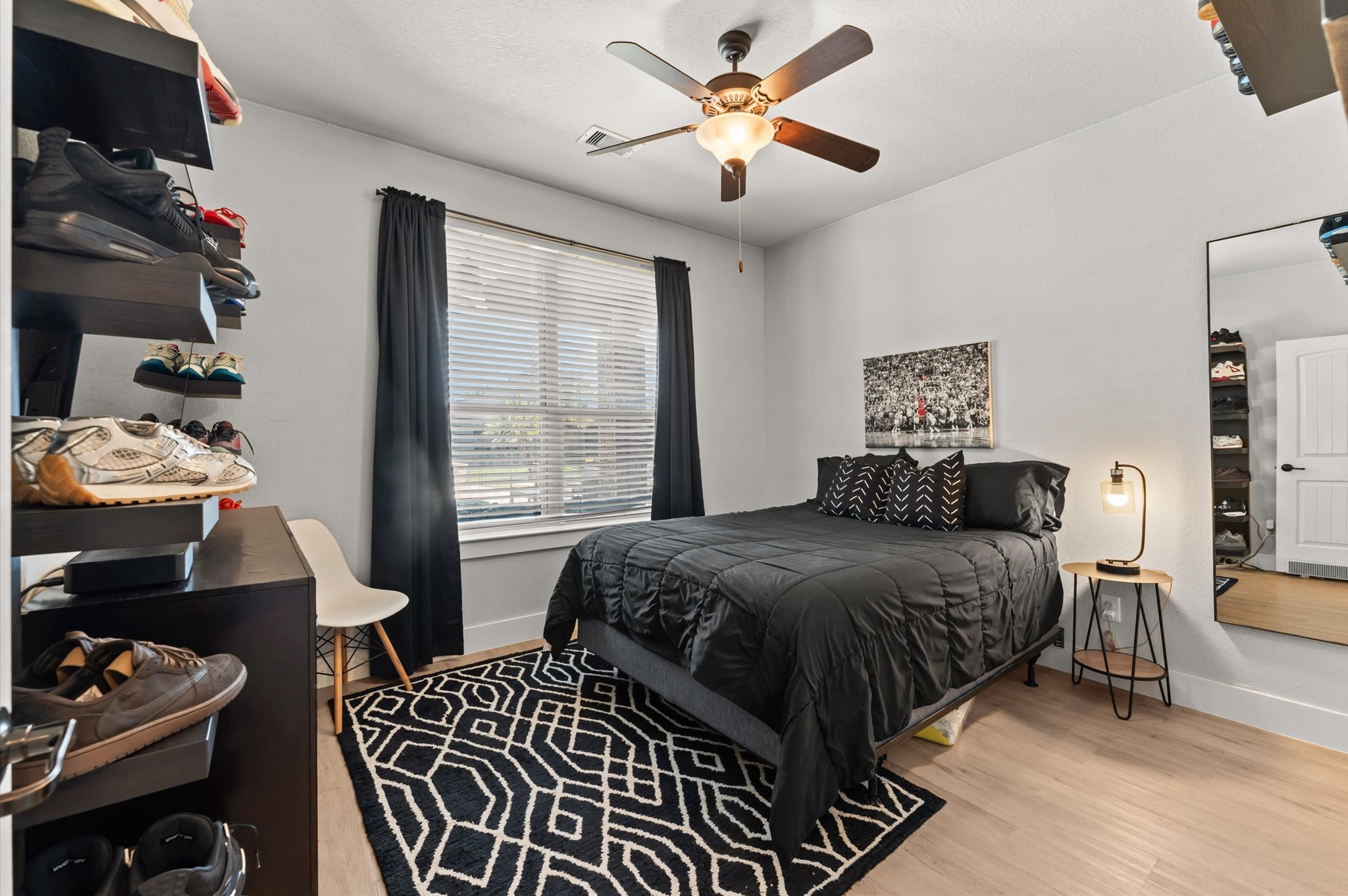 14016 Savannah Landing Lane Rosharon, TX 77583 - Photo 23 of 49 a bedroom with a bed and a chandelier