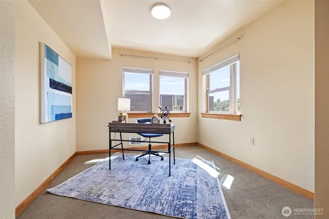 a workspace with furniture and a window