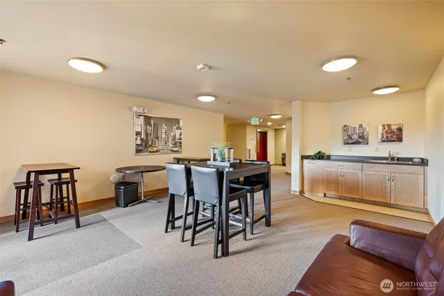 a kitchen with a table and chairs in it
