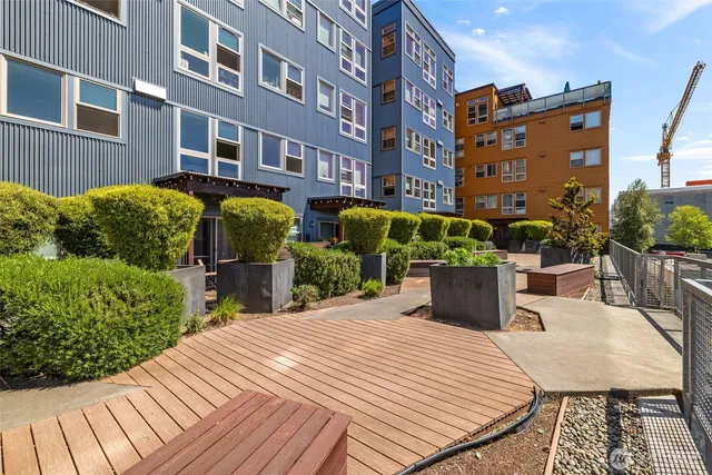 a view of a building and bench in the patio