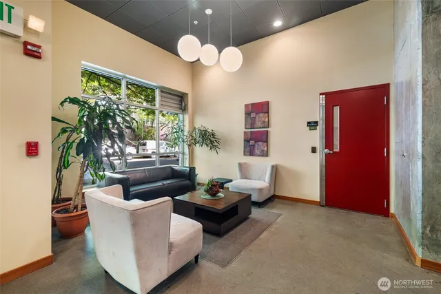 a living room with furniture and a large window