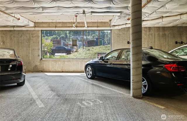 a view of a livingroom with furniture and a garage