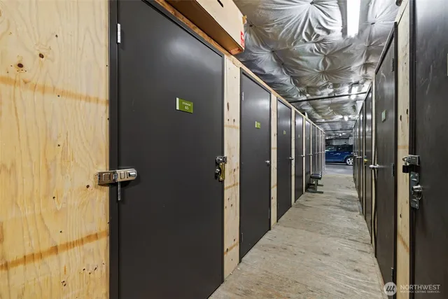 a front view of a building with red door and a window
