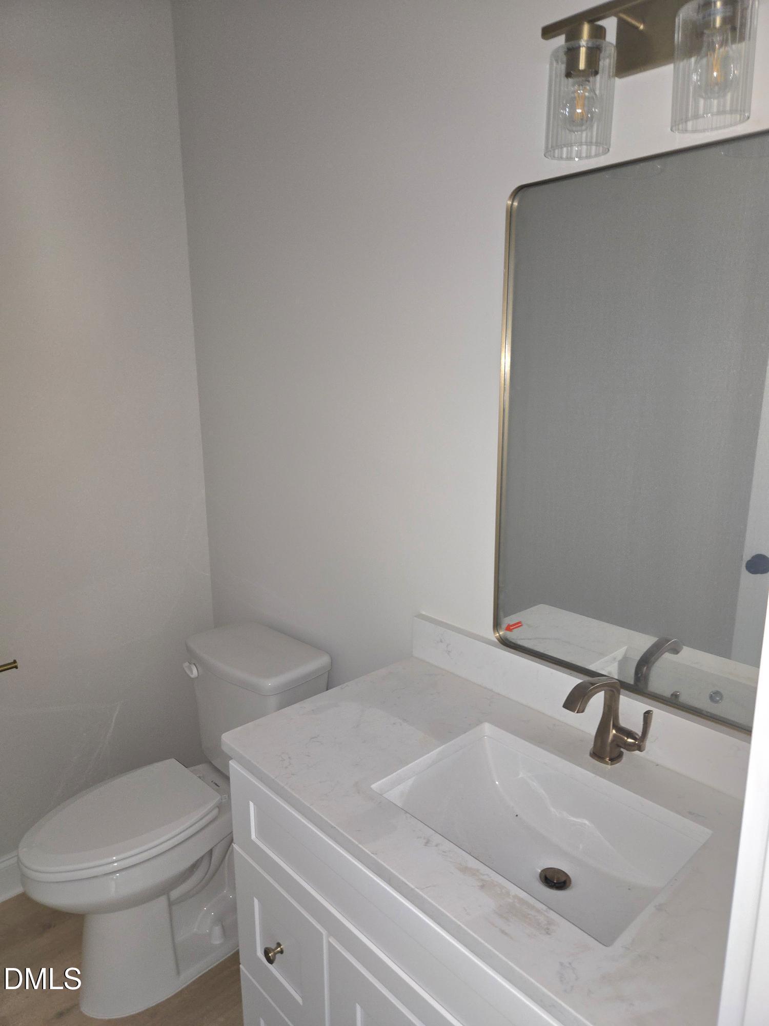 300 Avery Road Erwin, NC 28339 - Photo 11 of 38 a bathroom with a sink and toilet