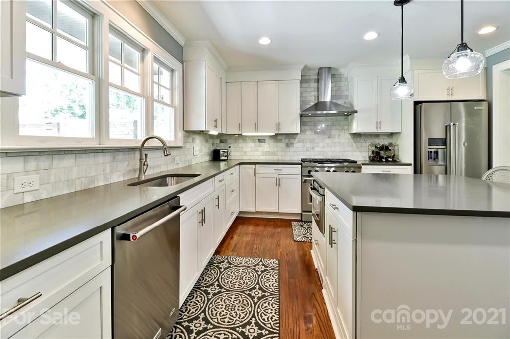 1901 Truman Road Charlotte, NC 28205 - Photo 14 of 39 a kitchen with a sink stove and refrigerator