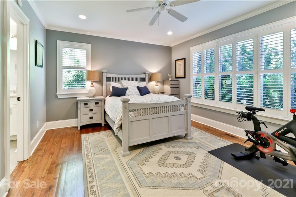 1901 Truman Road Charlotte, NC 28205 - Photo 16 of 39 a bedroom with a bed couch and a large window