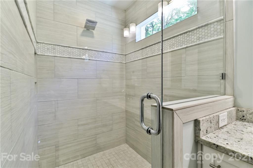 1901 Truman Road Charlotte, NC 28205 - Photo 18 of 39 a bathroom with a sink and shower