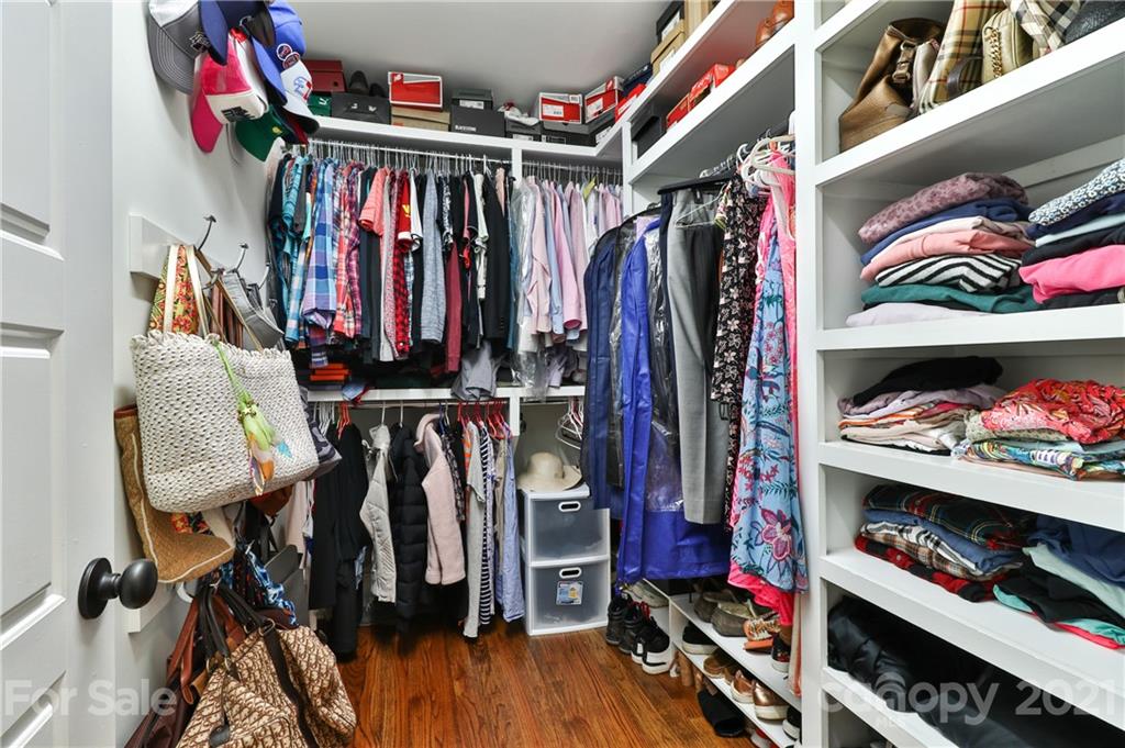 1901 Truman Road Charlotte, NC 28205 - Photo 19 of 39 a view of walk in closet with clothes and shoes