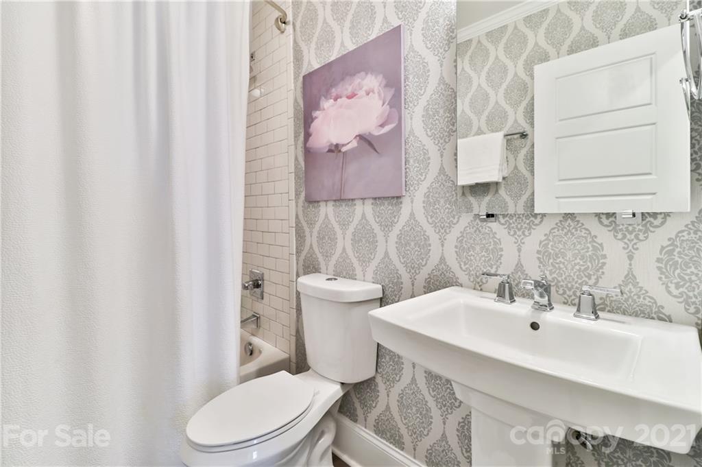 1901 Truman Road Charlotte, NC 28205 - Photo 21 of 39 a bathroom with a sink a toilet and a mirror