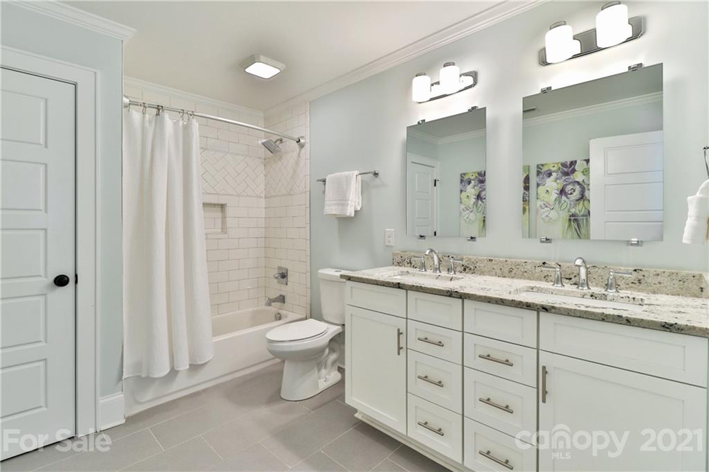 1901 Truman Road Charlotte, NC 28205 - Photo 26 of 39 a bathroom with a granite countertop sink toilet and shower