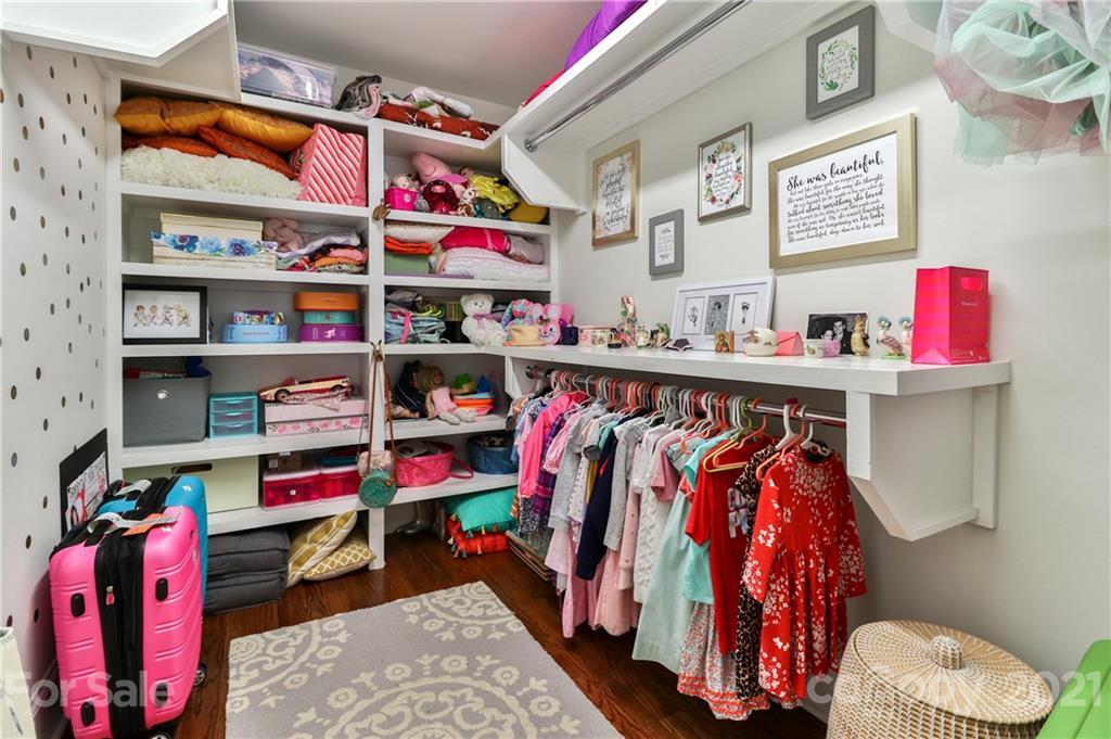 1901 Truman Road Charlotte, NC 28205 - Photo 27 of 39 a view of walk in closet with clothes and shoes