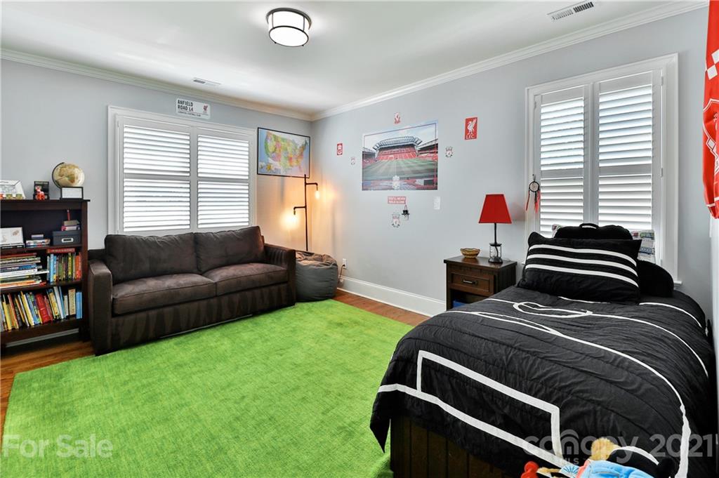 1901 Truman Road Charlotte, NC 28205 - Photo 29 of 39 a bedroom with a bed and a window