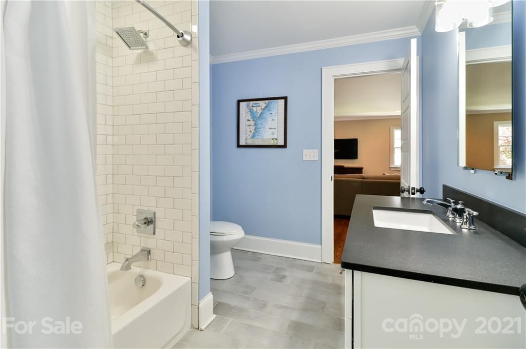 1901 Truman Road Charlotte, NC 28205 - Photo 30 of 39 a bathroom with a bathtub sink and toilet