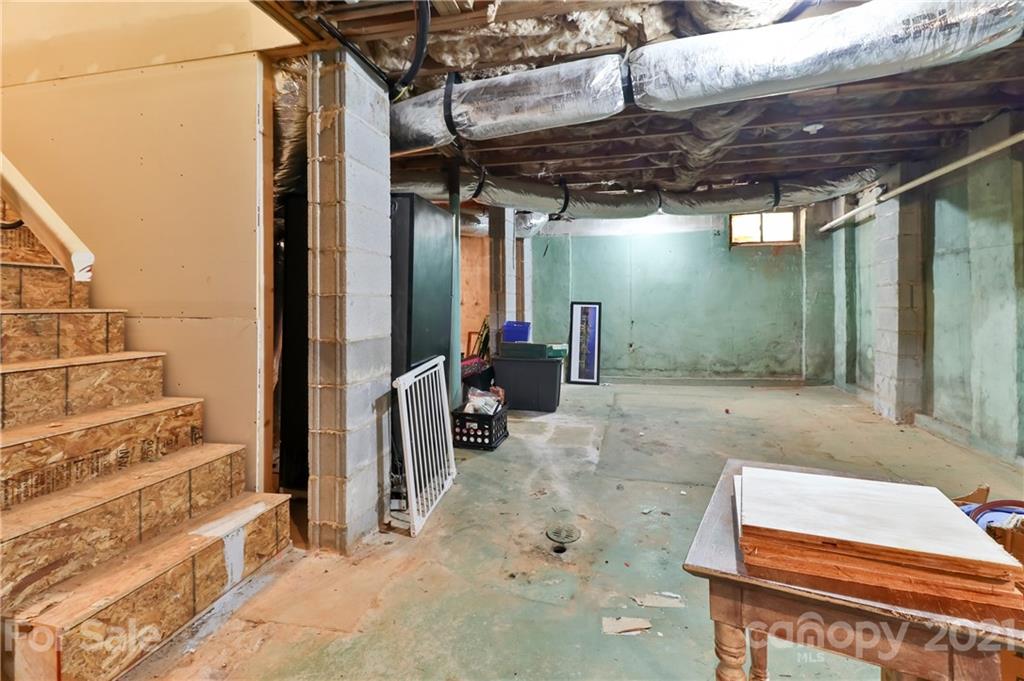 1901 Truman Road Charlotte, NC 28205 - Photo 32 of 39 a backyard of a house with barbeque oven table and chairs