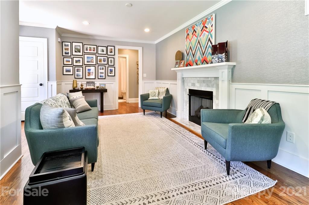 1901 Truman Road Charlotte, NC 28205 - Photo 8 of 39 a living room with furniture and a fireplace