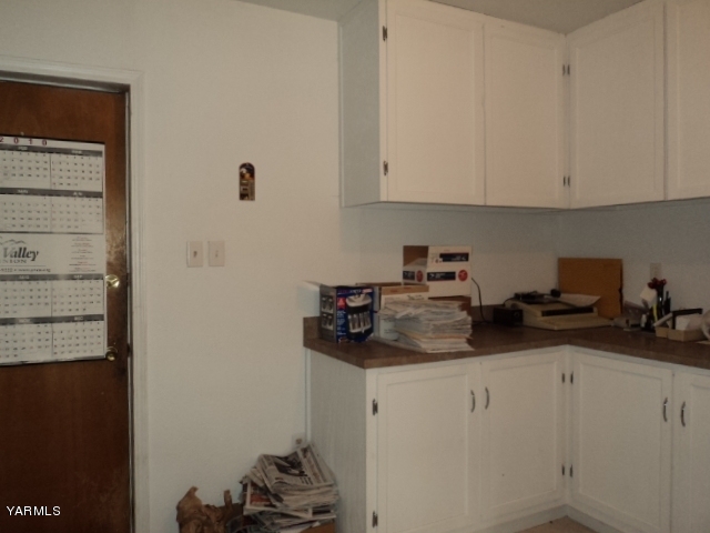 6701 East Beauchene Road Moxee, WA 98936 - Photo 16 of 27 a kitchen with a sink and cabinets