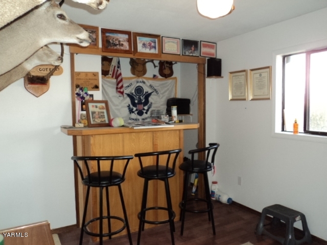 6701 East Beauchene Road Moxee, WA 98936 - Photo 19 of 27 a dining room with furniture and wooden floor