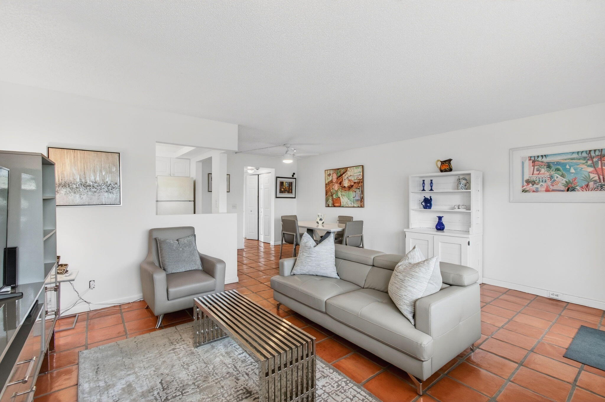 a living room with furniture and a rug
