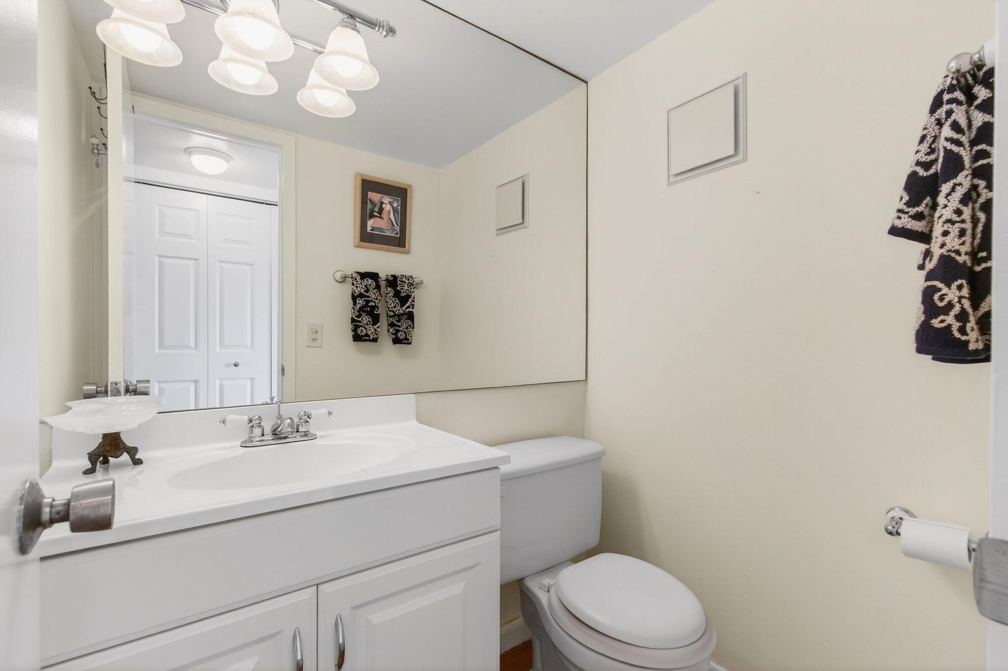 359 Brighton I Boca Raton, FL 33434 - Photo 11 of 34 a bathroom with a sink a toilet and mirror