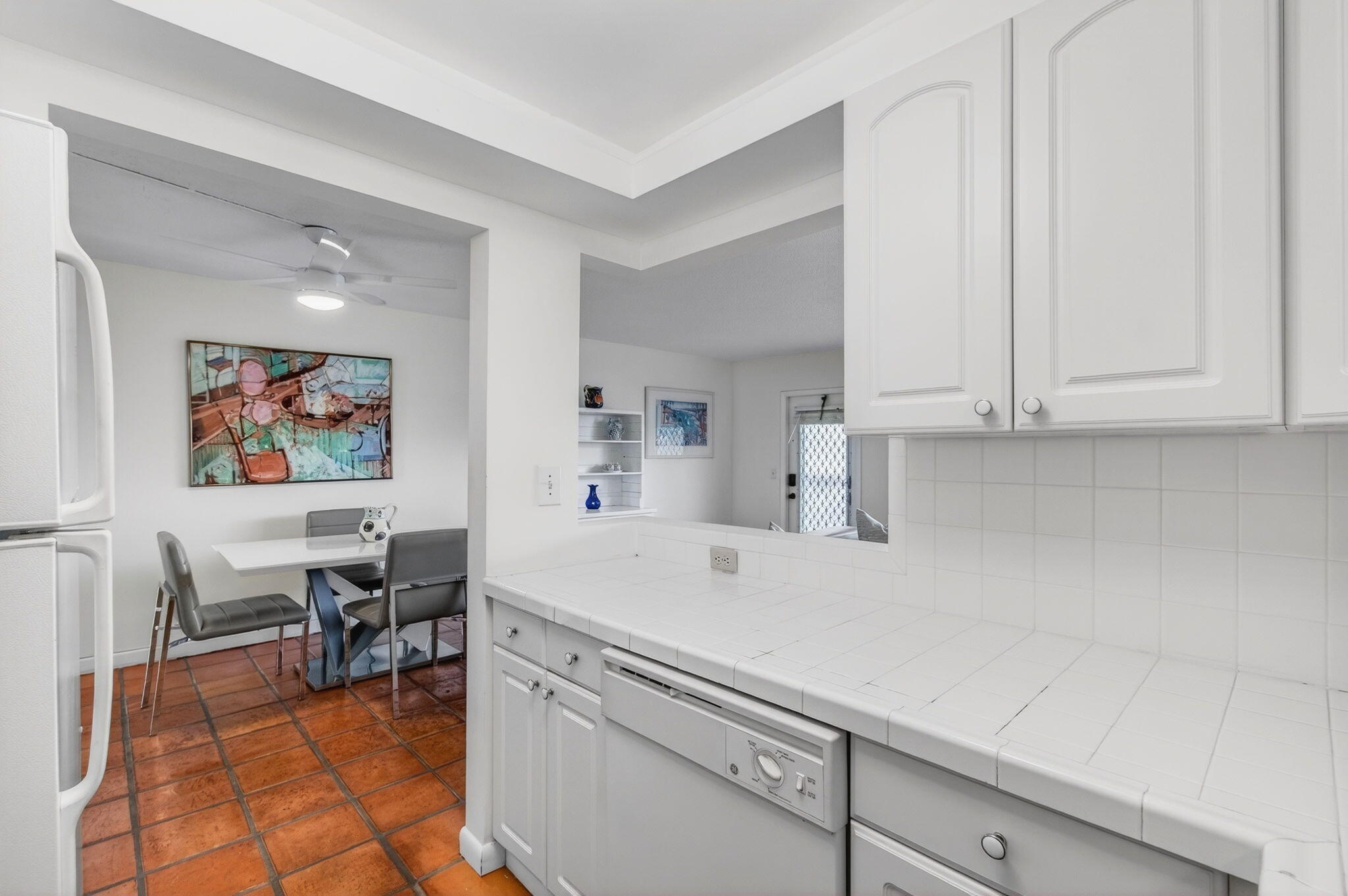 359 Brighton I Boca Raton, FL 33434 - Photo 12 of 34 a view of kitchen with furniture and refrigerator
