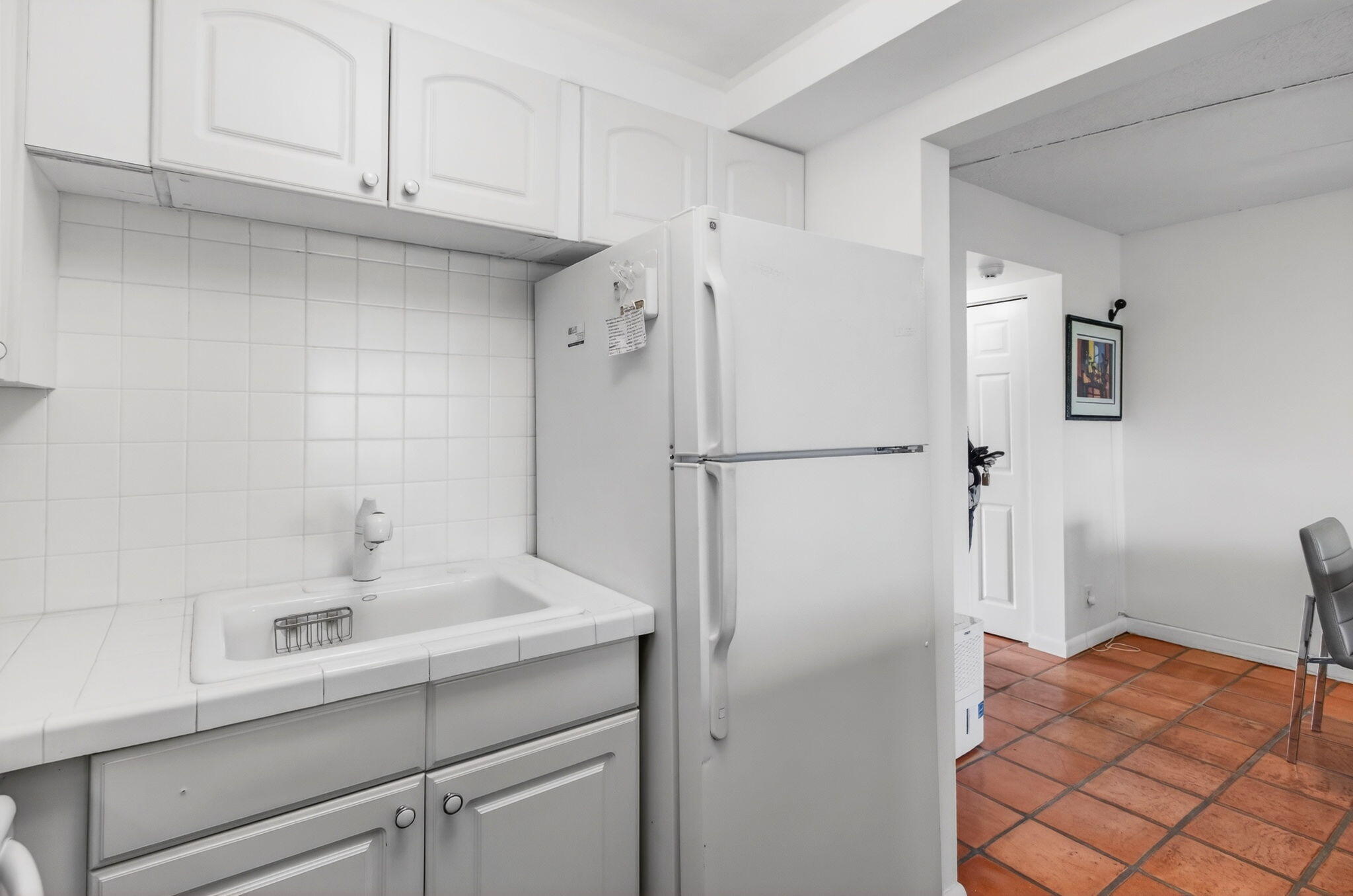 359 Brighton I Boca Raton, FL 33434 - Photo 13 of 34 a bathroom with a sink and a shower