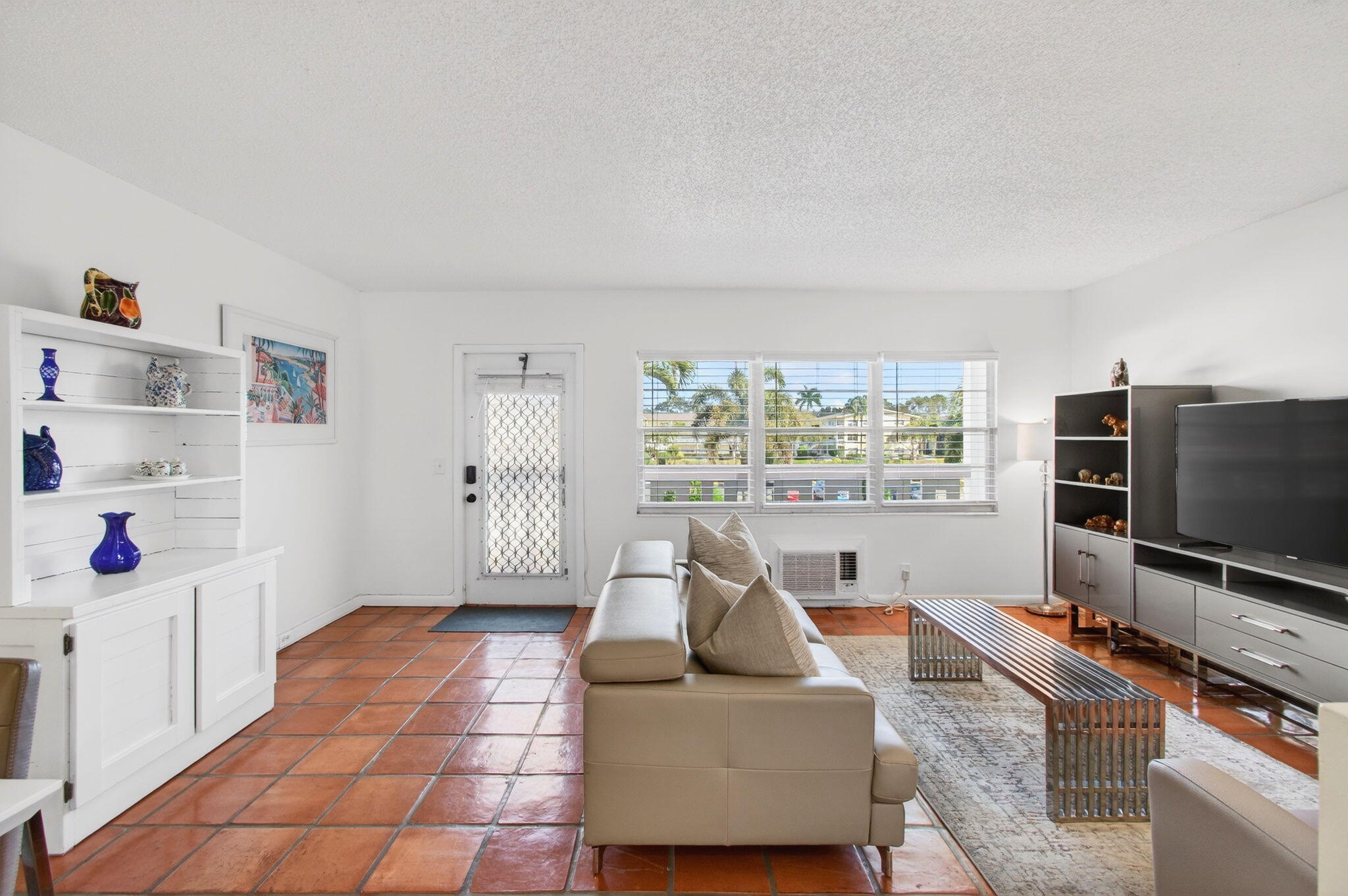359 Brighton I Boca Raton, FL 33434 - Photo 6 of 34 a living room with furniture and a flat screen tv