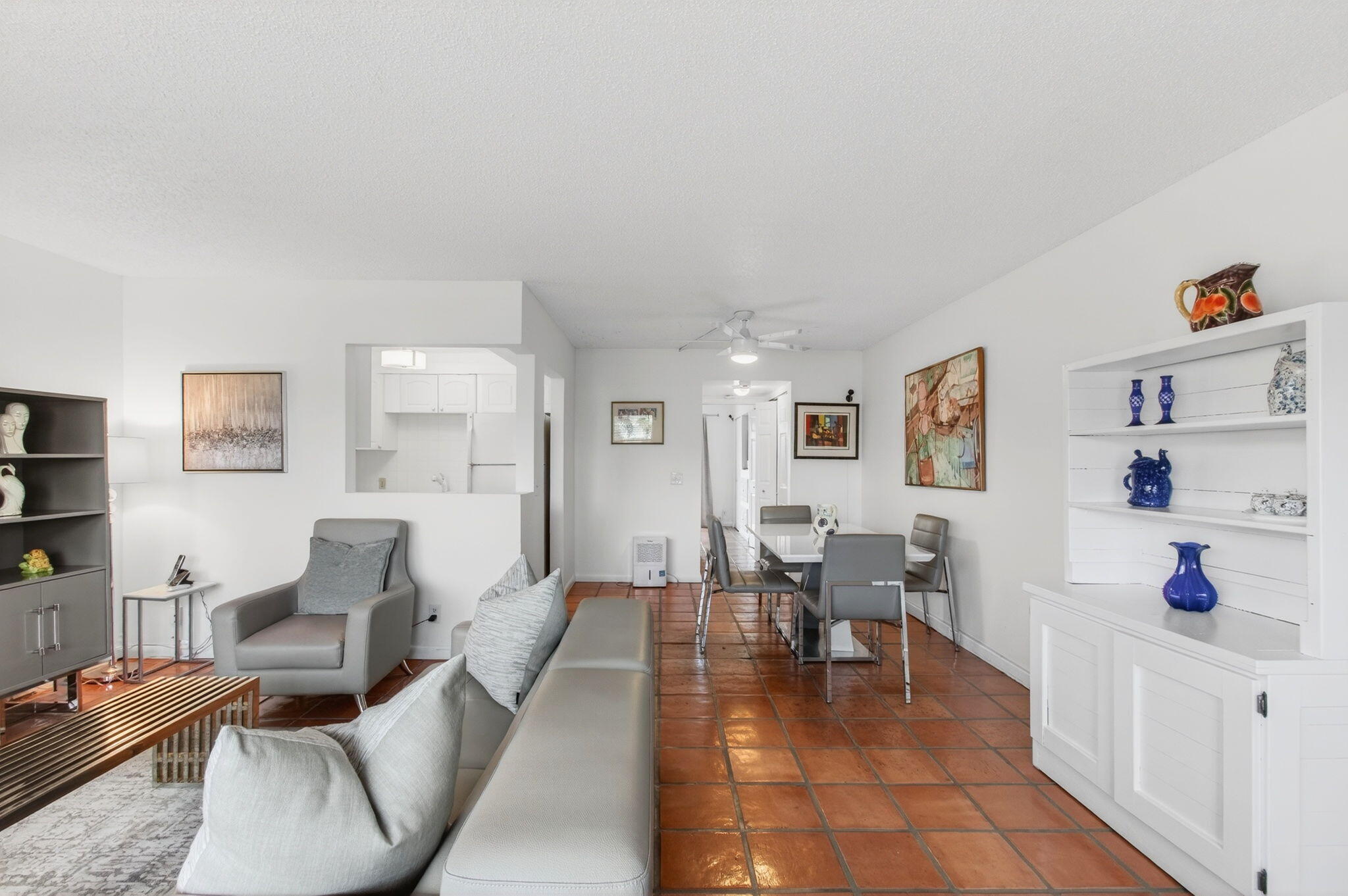 359 Brighton I Boca Raton, FL 33434 - Photo 9 of 34 a living room with furniture and a table