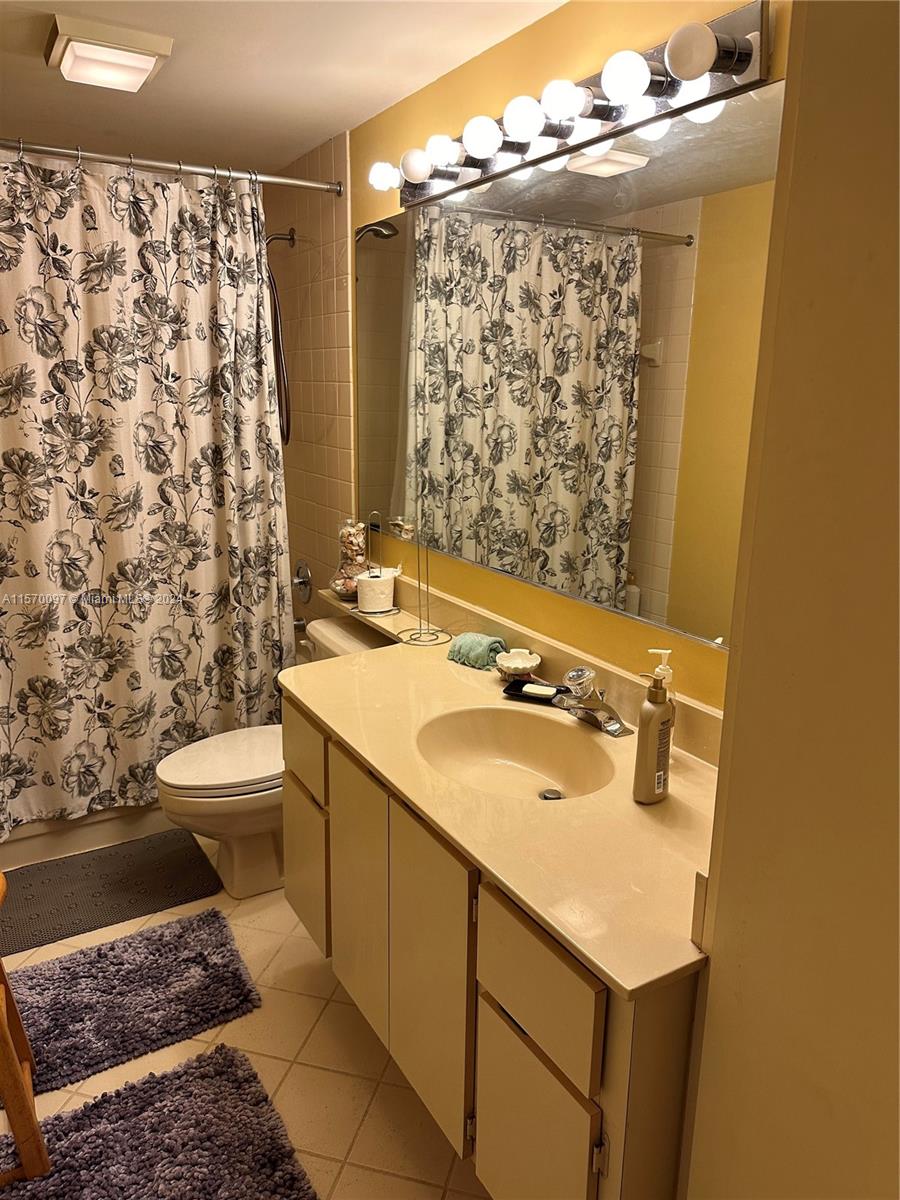2413 24th Court Jupiter, FL 33477 - Photo 21 of 32 a bathroom with a sink toilet and shower