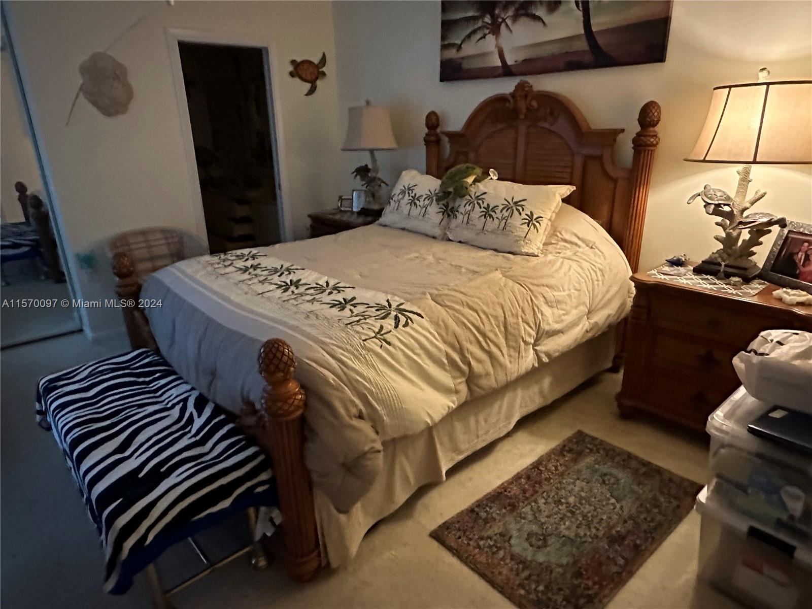 2413 24th Court Jupiter, FL 33477 - Photo 23 of 32 a bedroom with a bed and wooden floor