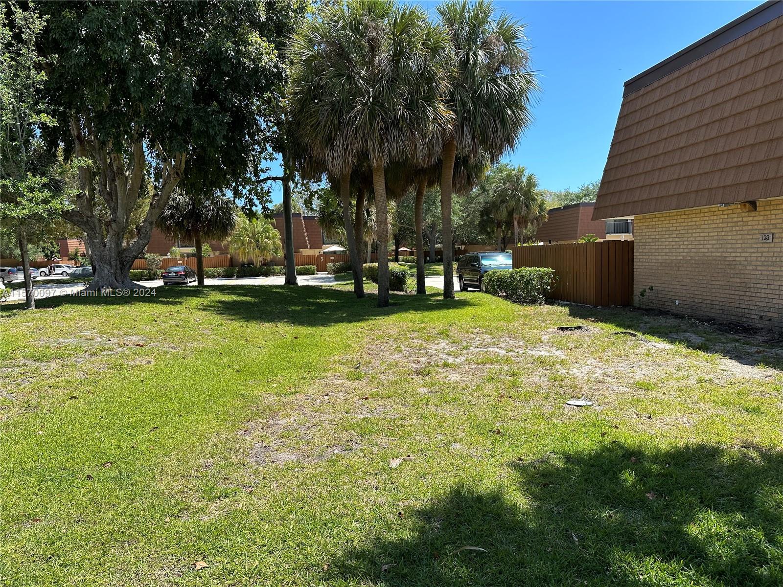 2413 24th Court Jupiter, FL 33477 - Photo 28 of 32 a view of a backyard with swimming pool