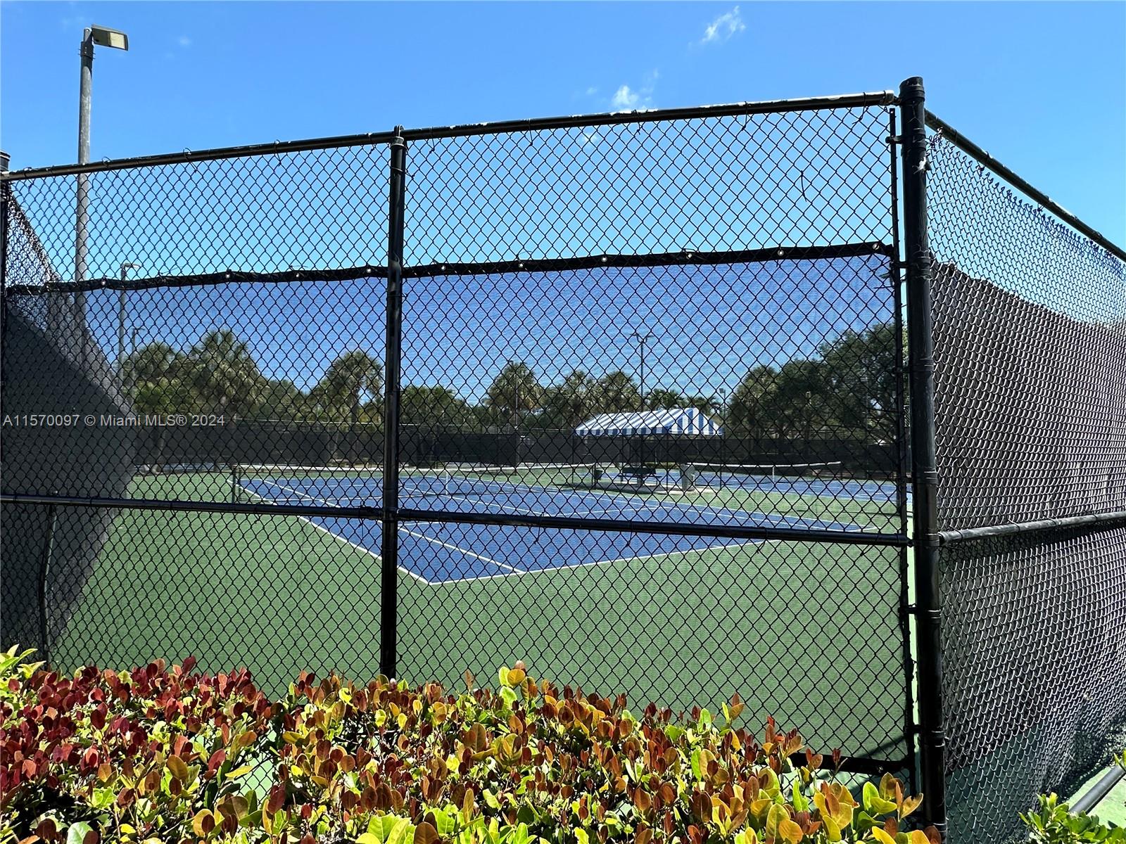 2413 24th Court Jupiter, FL 33477 - Photo 31 of 32 a view of a tennis court