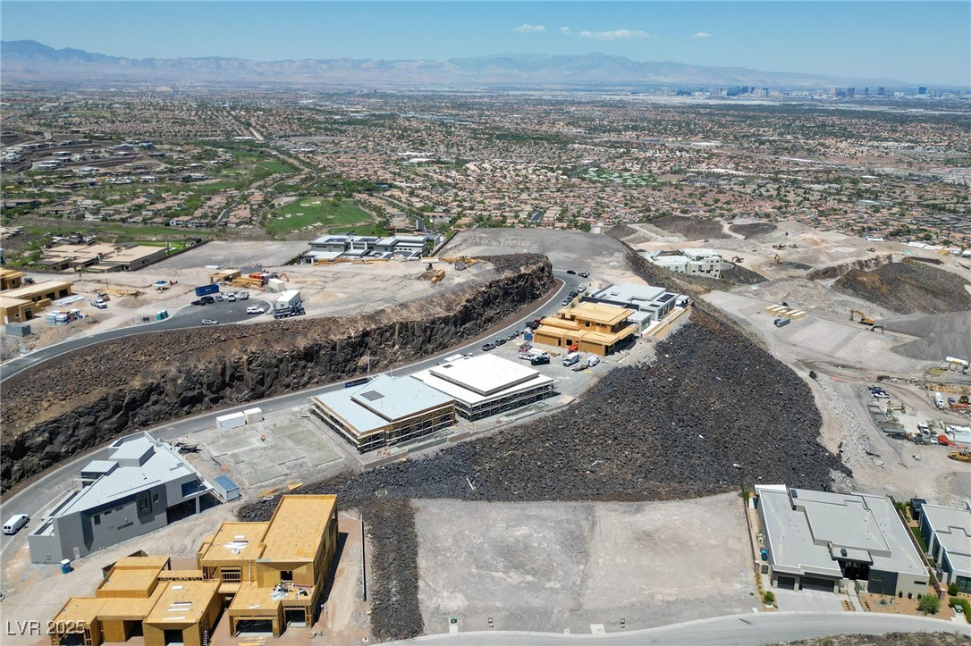 475 Cityview Ridge Drive Henderson, NV 89012 - Photo 4 of 28 Aerial overview of property's location with a mountain backdrop and nearby suburban area