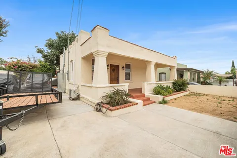 a front view of a house with a patio
