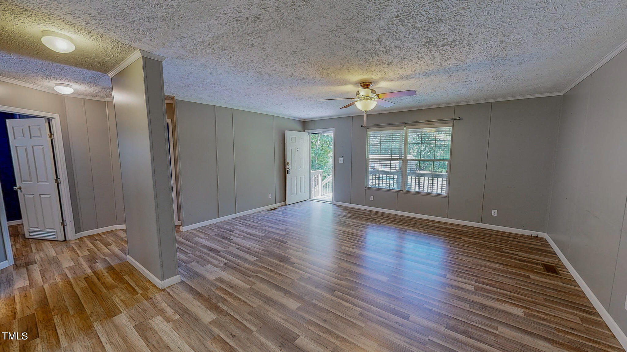 44 Pheasant Way Roxboro, NC 27574 - Photo 14 of 46 wooden floor in an empty room with a window