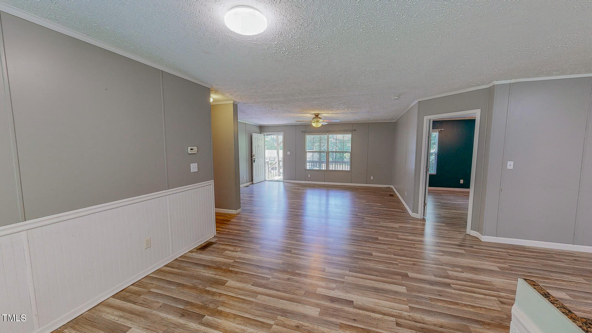 44 Pheasant Way Roxboro, NC 27574 - Photo 17 of 46 wooden floor in an empty room with a window