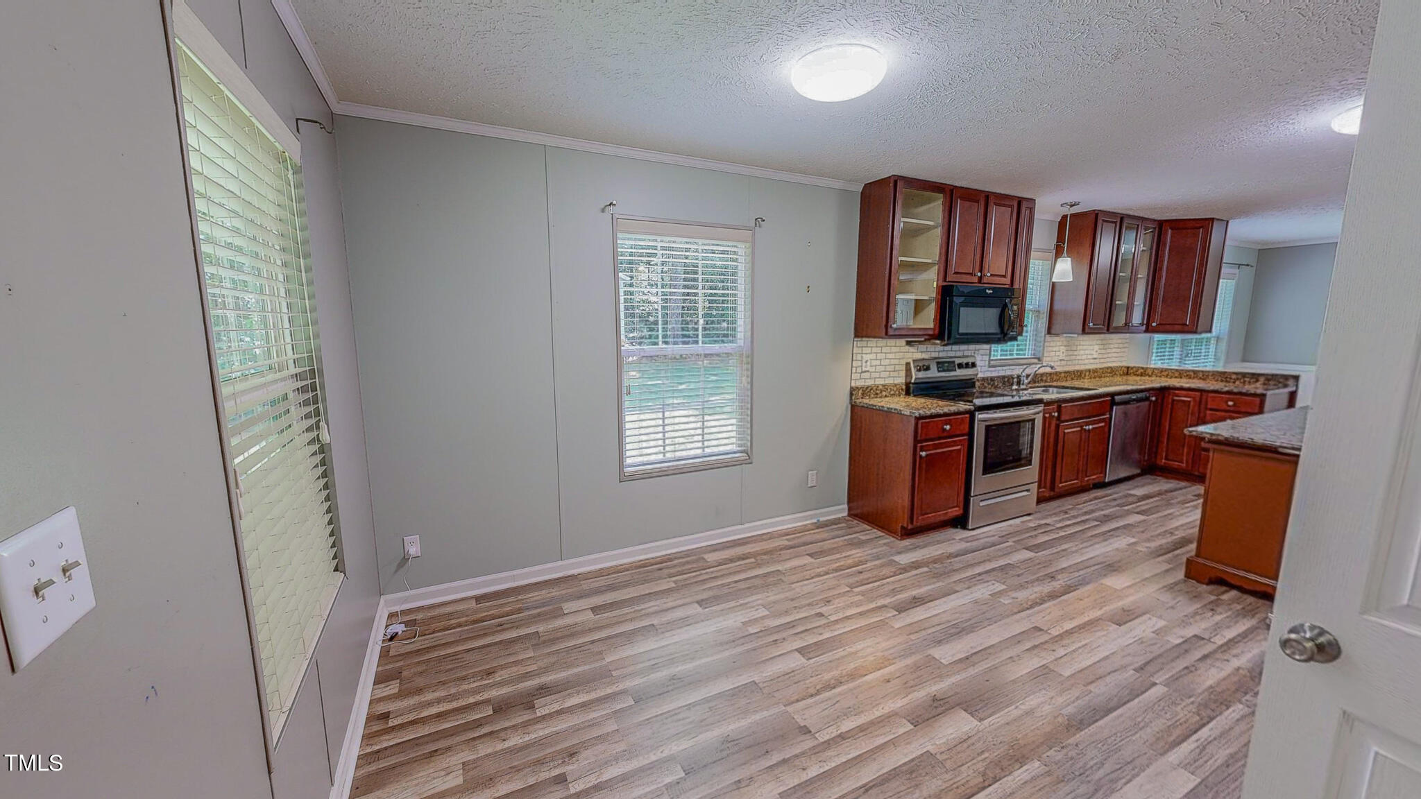 44 Pheasant Way Roxboro, NC 27574 - Photo 20 of 46 a kitchen with stainless steel appliances granite countertop a stove and a sink
