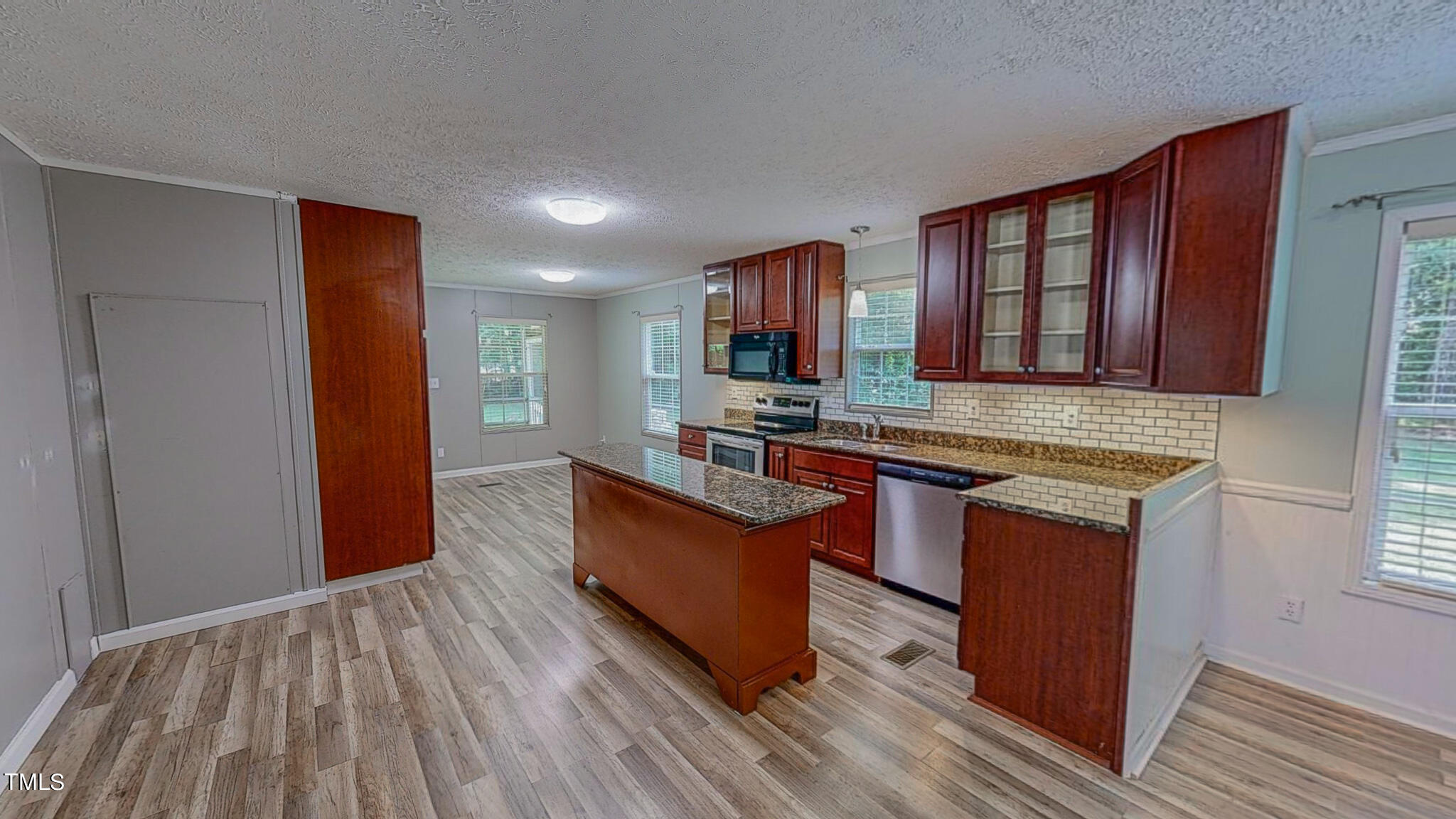 44 Pheasant Way Roxboro, NC 27574 - Photo 2 of 46 a kitchen with stainless steel appliances granite countertop a stove a sink and a refrigerator