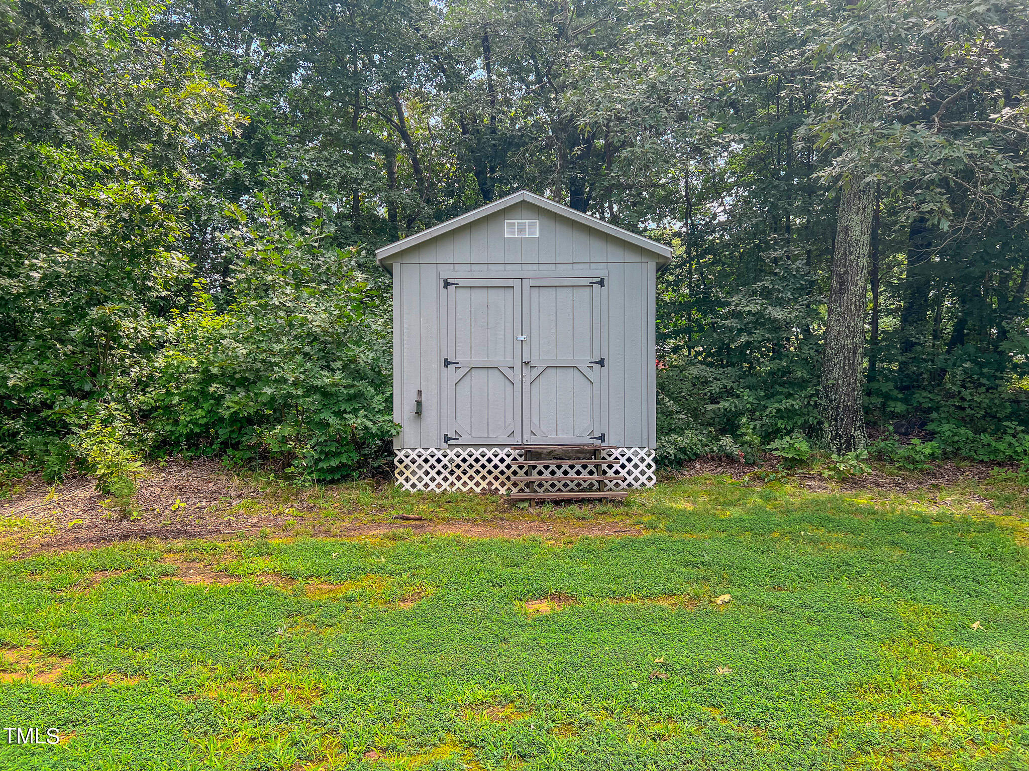 44 Pheasant Way Roxboro, NC 27574 - Photo 26 of 46 a view of a house with a yard and large trees