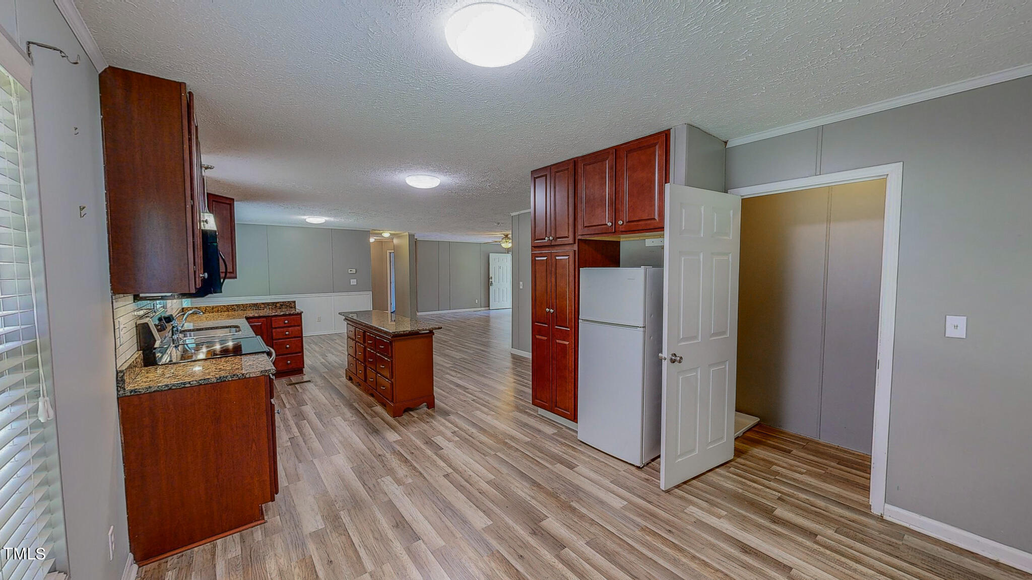 44 Pheasant Way Roxboro, NC 27574 - Photo 27 of 46 a open kitchen with stainless steel appliances granite countertop a refrigerator a sink dishwasher and a stove with wooden floor