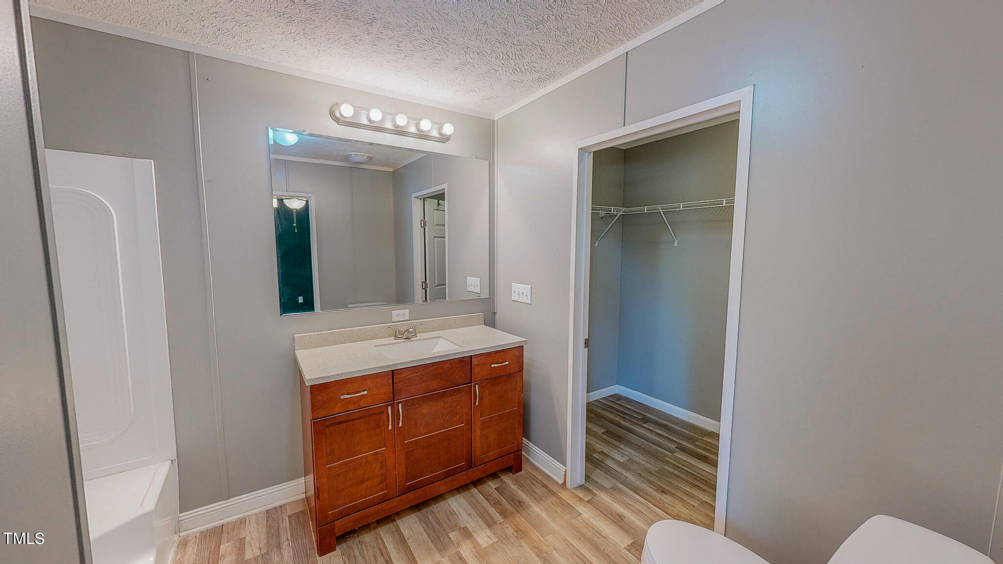 44 Pheasant Way Roxboro, NC 27574 - Photo 34 of 46 a bathroom with a granite countertop sink and a mirror