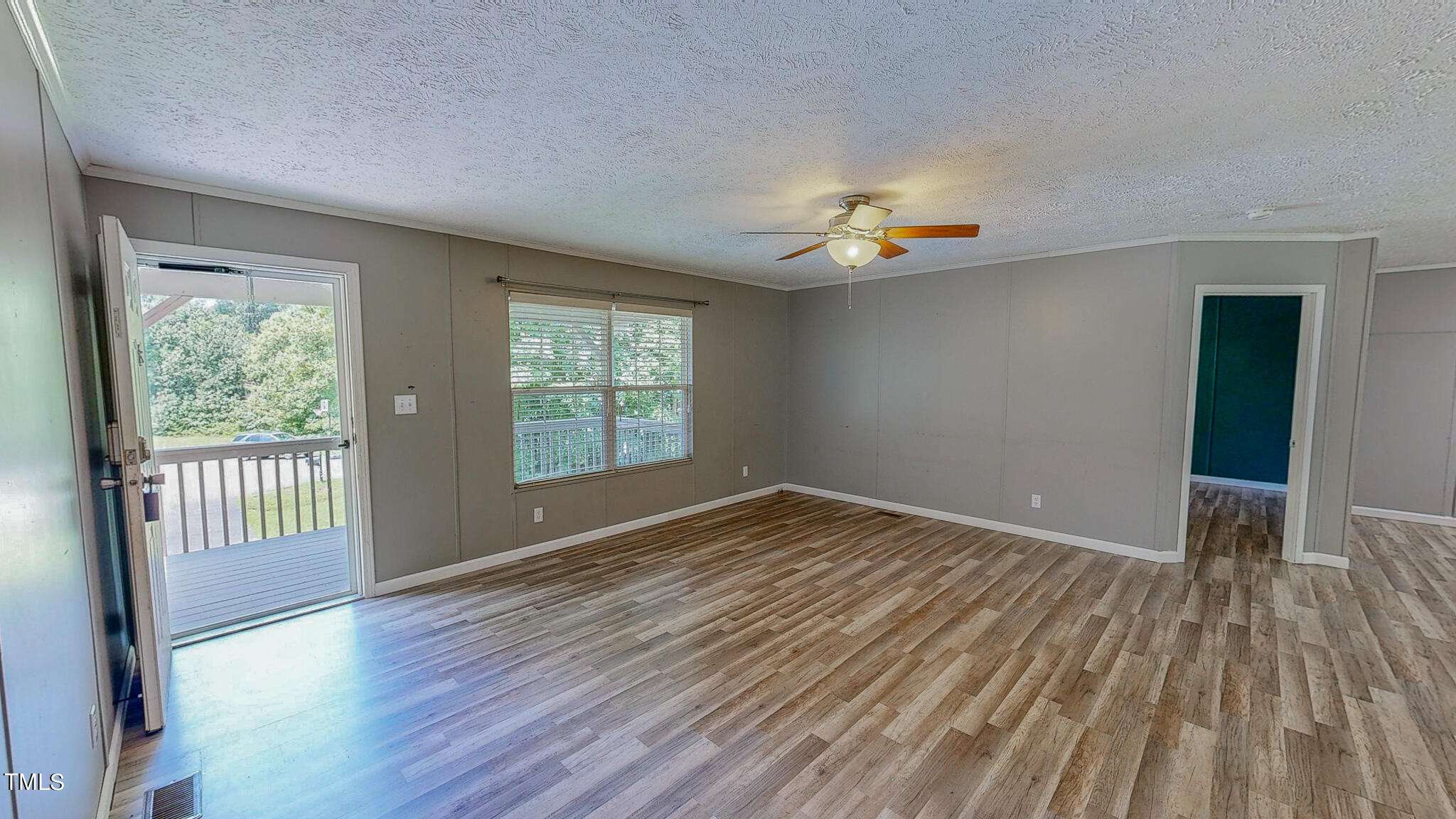 44 Pheasant Way Roxboro, NC 27574 - Photo 4 of 46 wooden floor in an empty room with a window